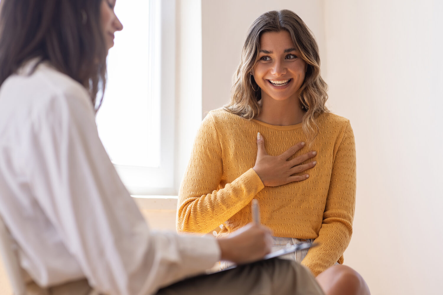 woman talking to healthcare provider at clinic